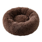 Lit donut en peluche marron, vue de dessus